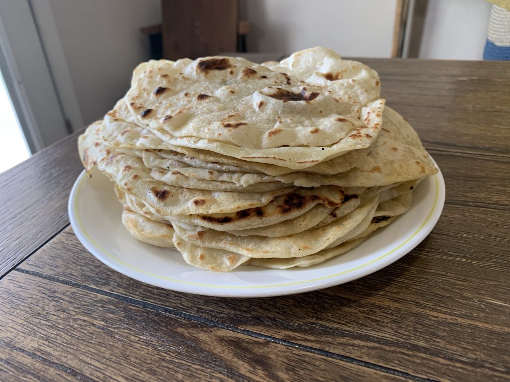 A warm stack of fresh flour tortillas